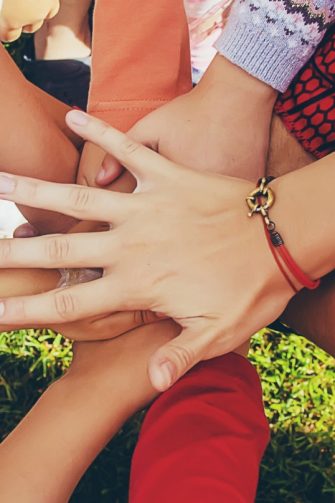 Relax, love and big family happy on sofa smile together in home on the weekend with children. Cheerful and diverse senior grandparents, parents and young kids in Brazil bond in living room