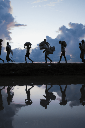 Thousands of new Rohingya refugee arrivals cross the border near Anzuman Para village, Palong Khali, Bangladesh.