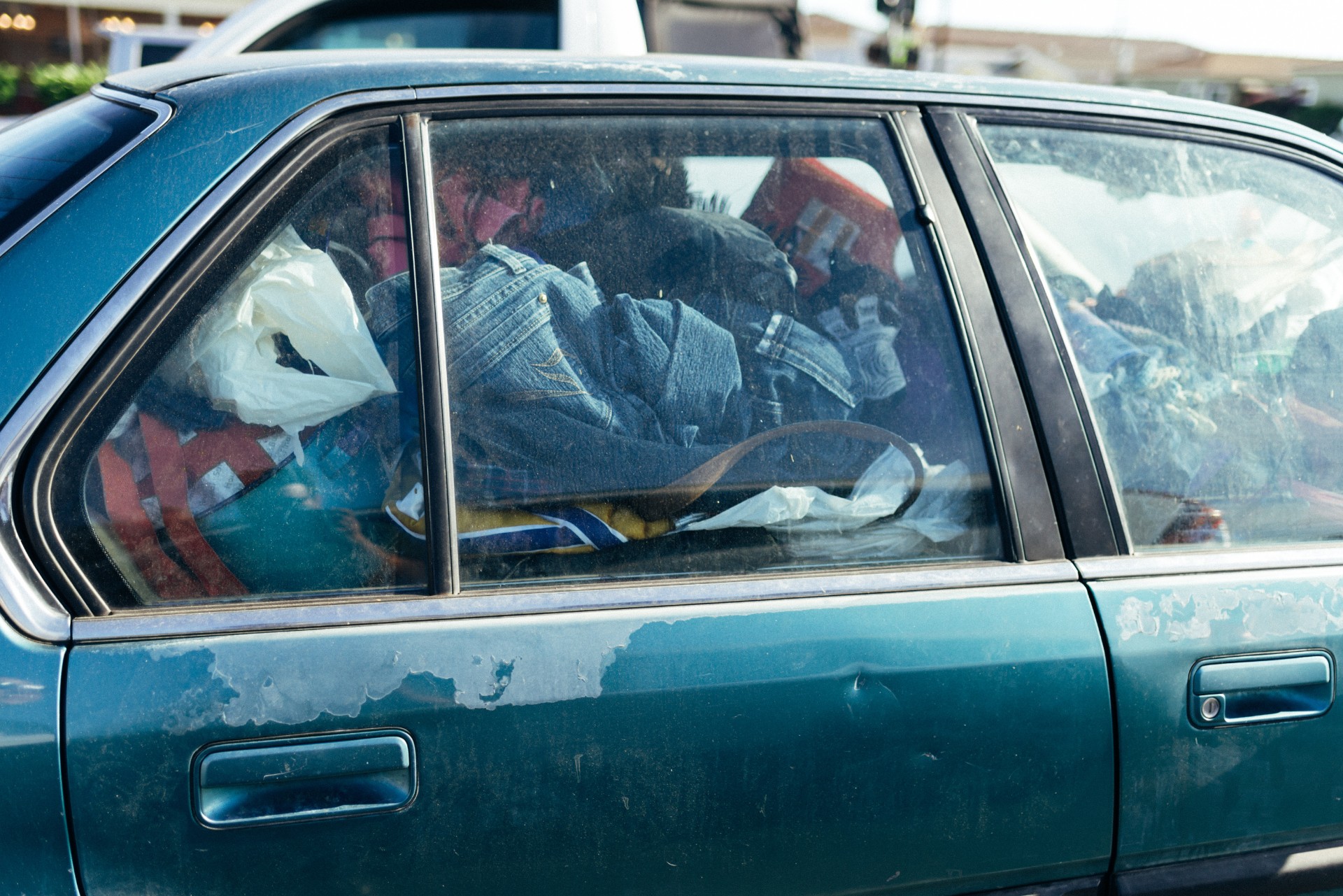 Possessions in a car depicting rough sleeping