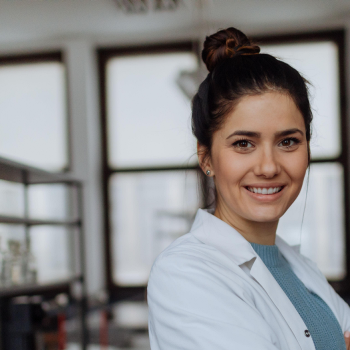 Young female scientist in lab coat