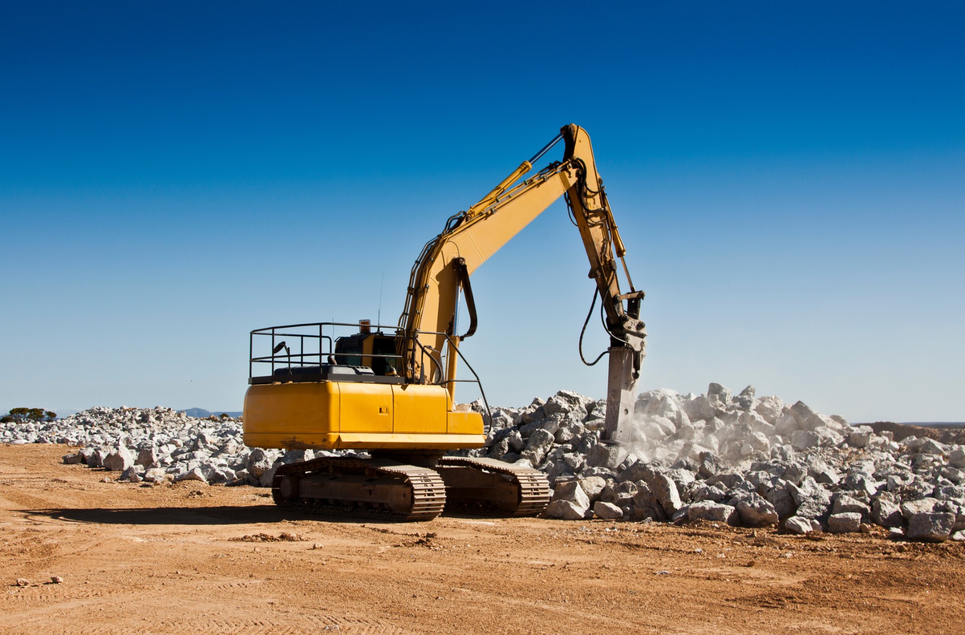 A breaking machine being used to crush spodumene ore in a lithium mine.