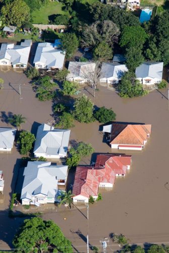 Homeowners checking ruins of their house and yard after fire