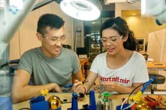 Students participating in desing and woodwork