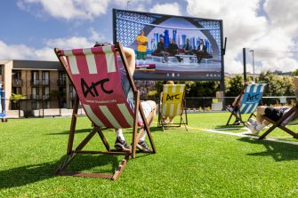 Students using UNSW's Village Green