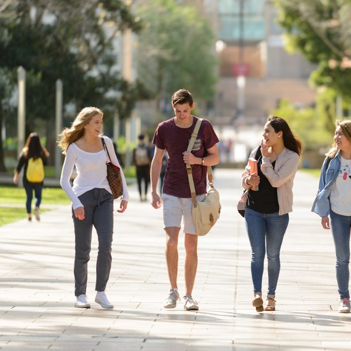 Students walking down the main walkway at the UNSW Kensington Campus