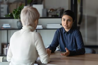 Photo of two people having a serious conversation