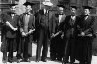 archive image of student graduates and professor
