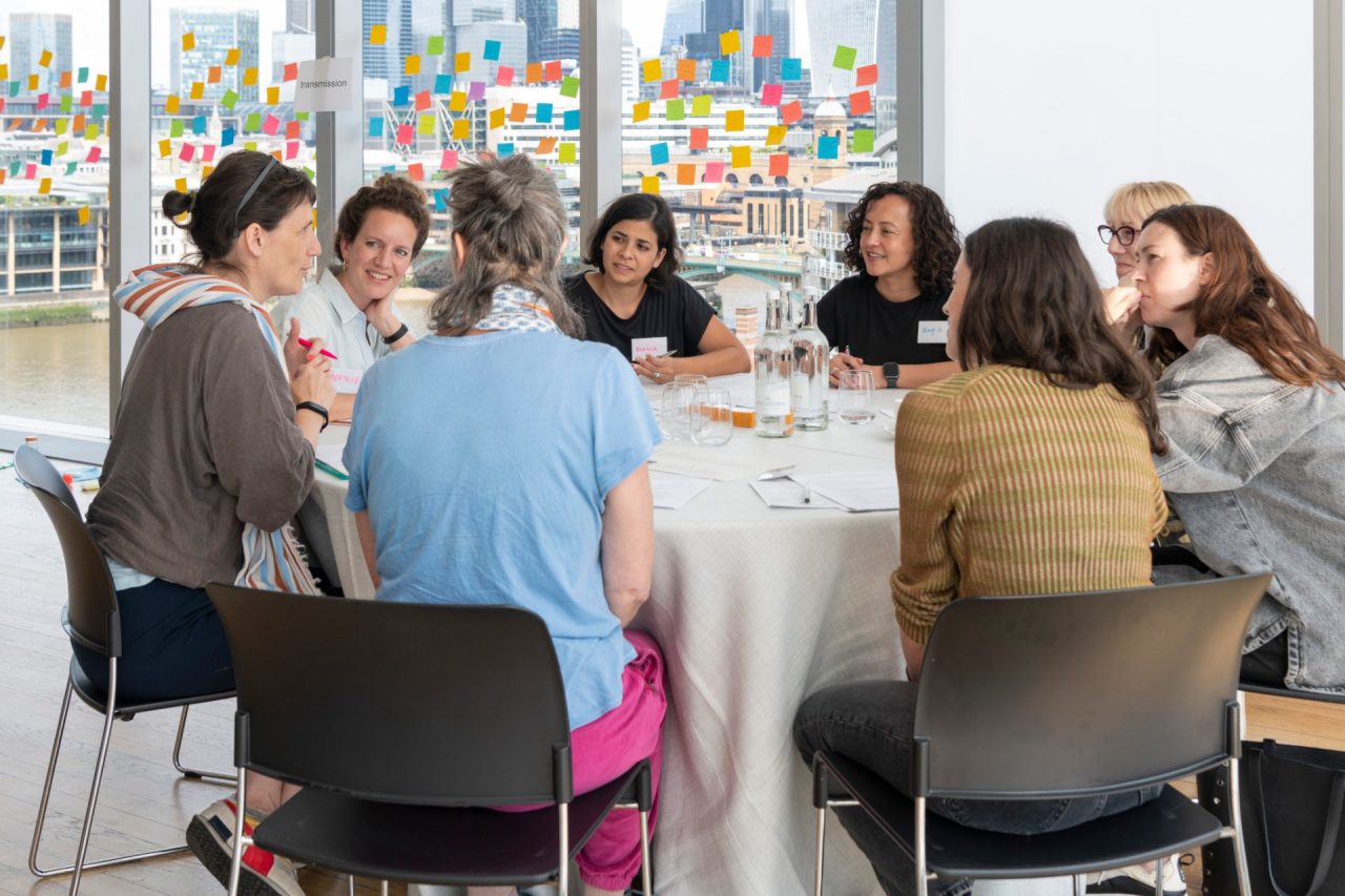 People around a table in discussion