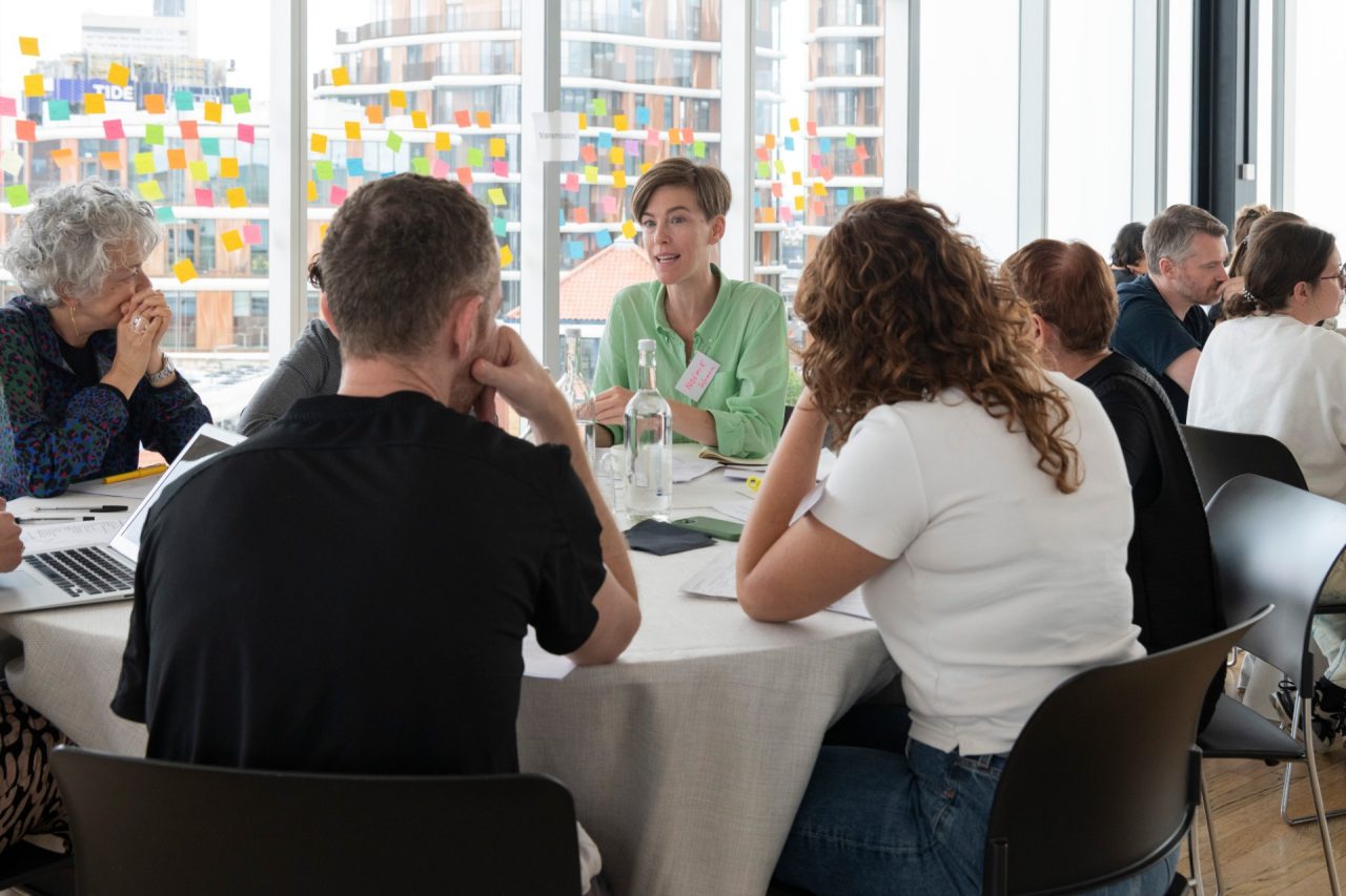 People around a table in discussion