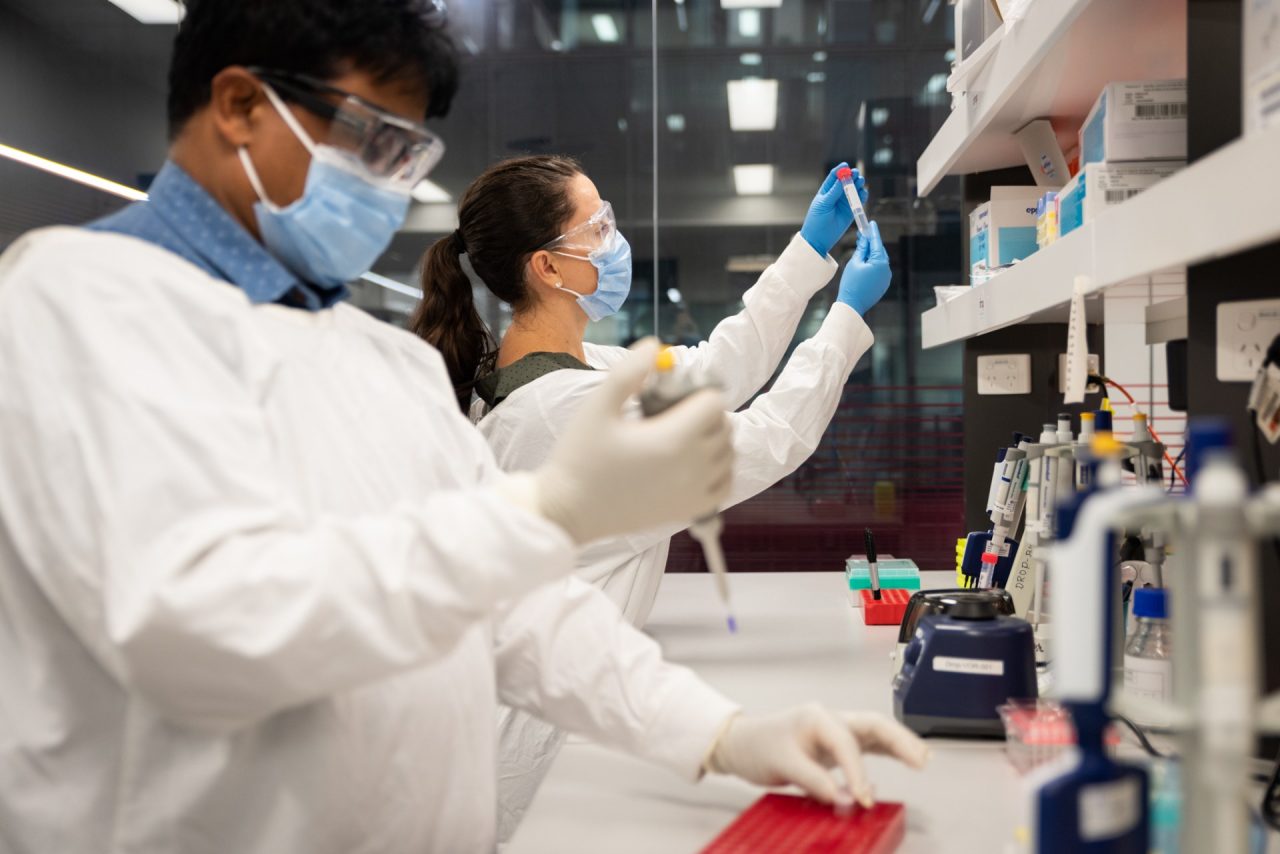 Students in lab examining chemicals