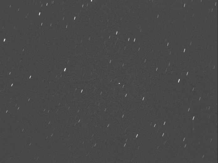 Asteroid 2011UL21 (near the centre) as seen by the Canberra Falcon