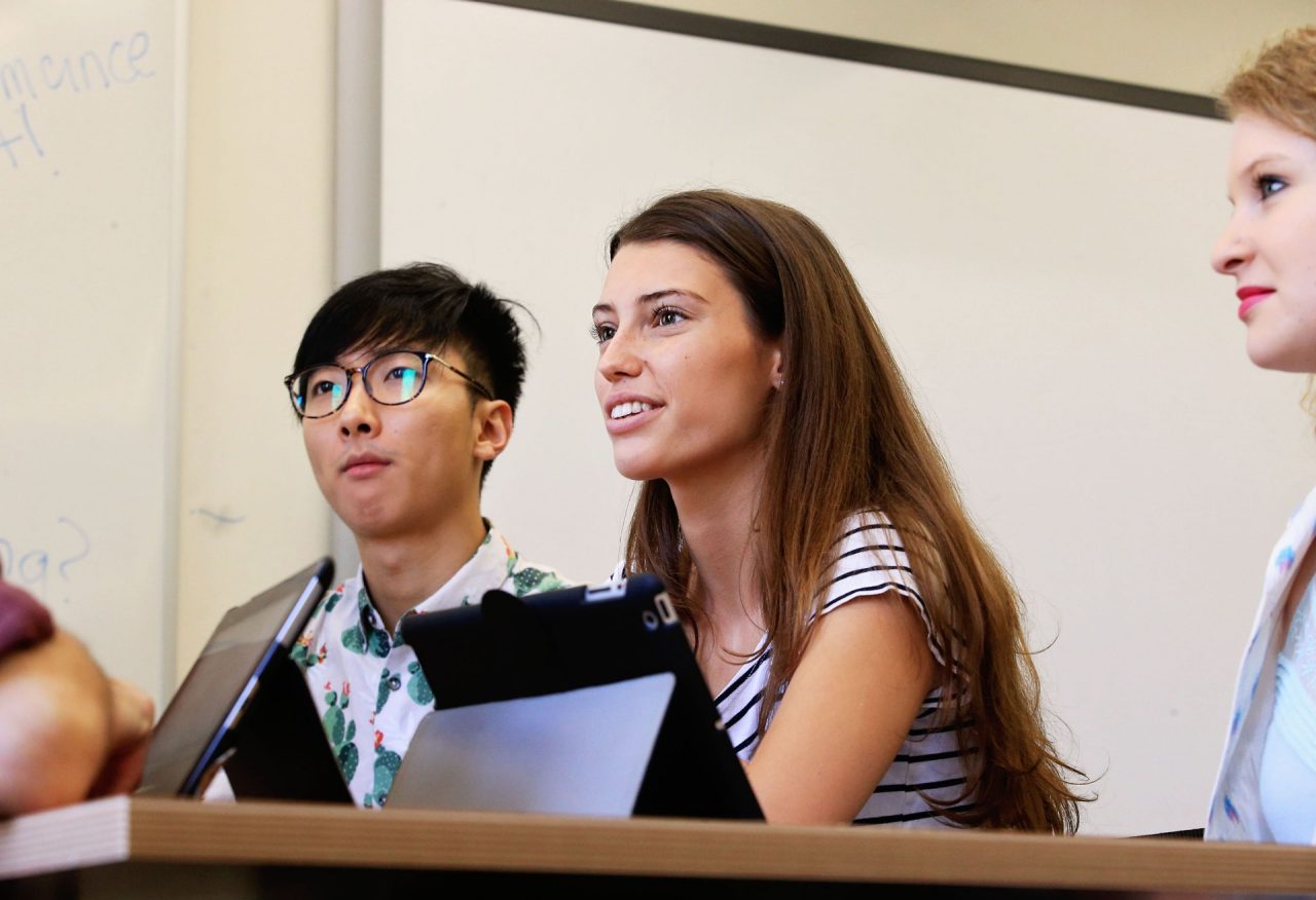 Students look to the front of the classroom
