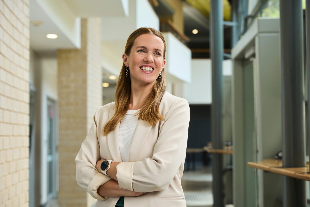 Female postgraduate student looking up 